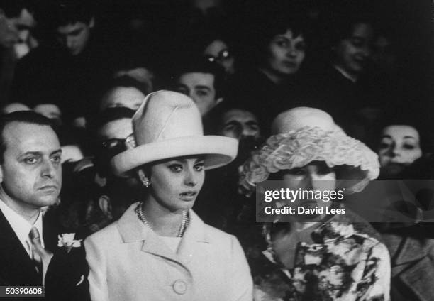 Sophia Loren and Mrs. Romilda Villani, attending the wedding of Romano Mussolini to Maria Scicolone.