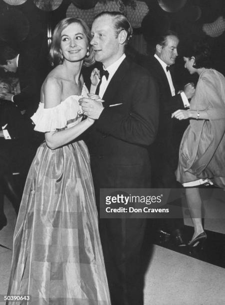 Robin Douglas-Home & his wife Sandra , dancing at party celebrating engagement of Frank Sinatra & Juliet Prowse, with Bob Hope in the background,...
