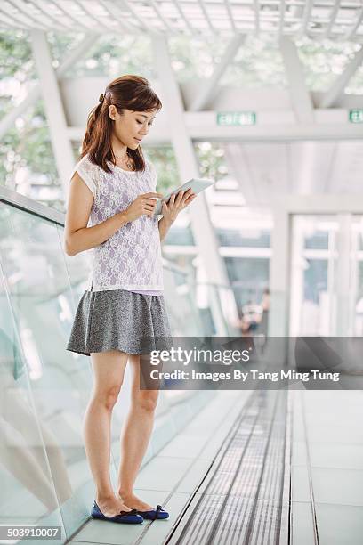 Young Business Woman Using Tablet In Lobby, Foto de stock