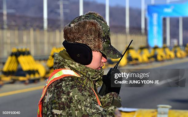 South Korean soldier talks over a radio on the road leading to North Korea's Kaesong joint industrial complex at a military checkpoint in the border...