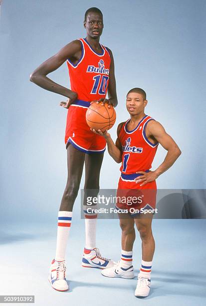 Manute Bol and Muggsy Bogues of the Washington Bullets poses together for this portrait circa 1987 at the Capital Centre in Landover, Maryland. Bol...
