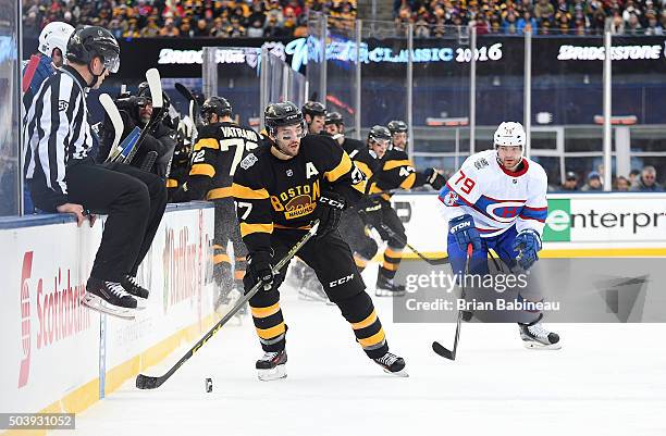 Patrice Bergeron of the Boston Bruins plays the puck through the netural zone as Andrei Markov of the Montreal Canadiens gives chase during the 2016...