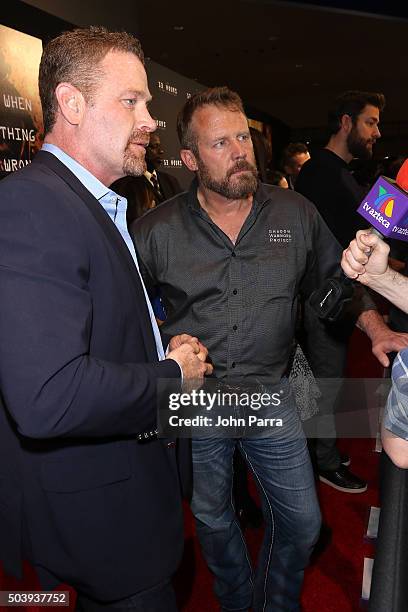 Max Martini and Co-author of "13 Hours" Mark "Oz" Geist attends the Miami Fan Screening of the Pramount Pictures film "13 Hours" at the AMC Aventura...