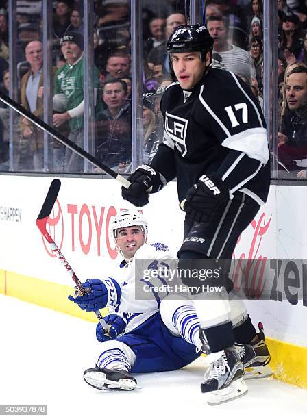 Nazem Kadri of the Toronto Maple Leafs reacts from the ice after a check from Milan Lucic of the Los Angeles Kings during the first period at Staples...