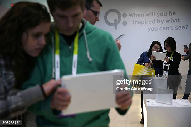 Show attendees participate in the Qualcomm Invisible Museum experience with tablets that show viewers different experiences of Qualcomm technologies,...