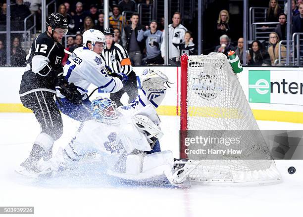 James Reimer of the Toronto Maple Leafs makes a save on Marian Gaborik of the Los Angeles Kings as Jake Gardiner looks for a rebound during the...