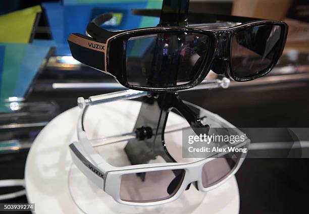 The Vuzix VidWear B3000 Wireless smart wireless video viewer/smartphone companion, bottom, and AR3000 fully featured pair of Augmented Reality Smart...