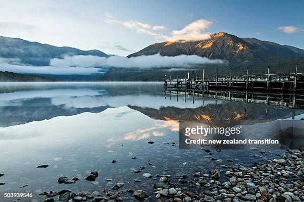first light on mt robert at lake rotoiti jetty, nelson lakes national park, new zealand - nelson lakes national park stock pictures, royalty-free photos & images