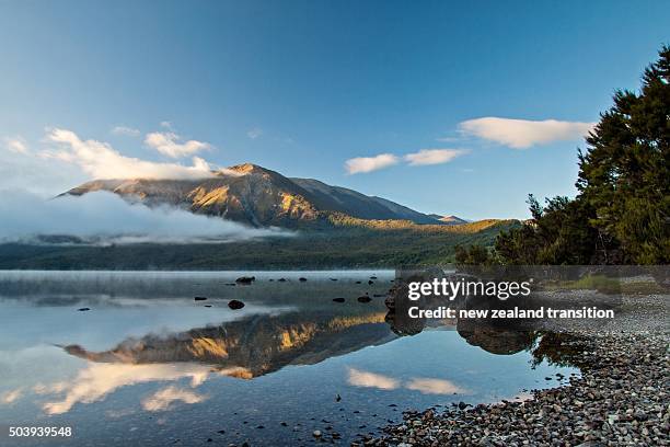 first light on mt robert at lake rotoiti, nelson lakes national park, new zealand - nelson lakes national park stock pictures, royalty-free photos & images