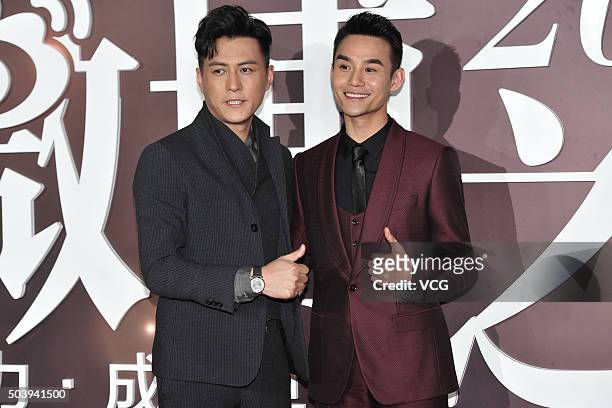 Actor Jin Dong and actor Wang Kai arrive at the red carpet of the 2015 Sina Weibo Award Ceremony at China World Trade Center Tower III on January 7,...