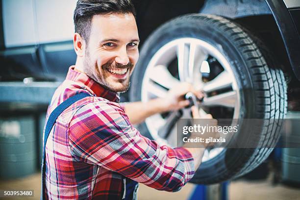 replacing car wheel and tyre. - torque wrench stock pictures, royalty-free photos & images