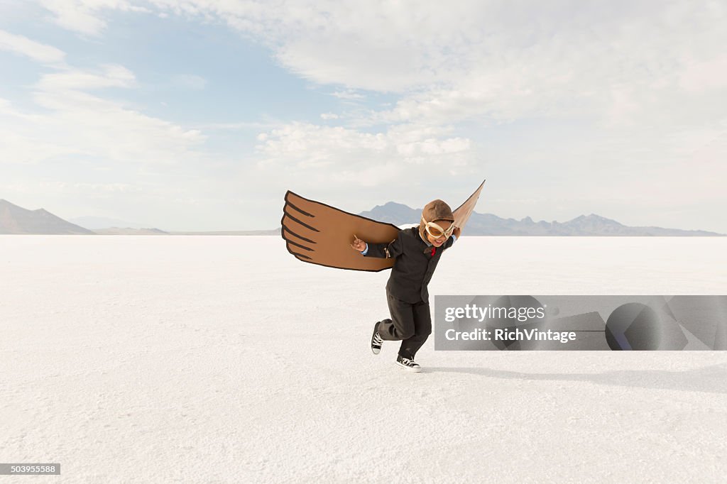 Young Boy Businessman is Flying Away