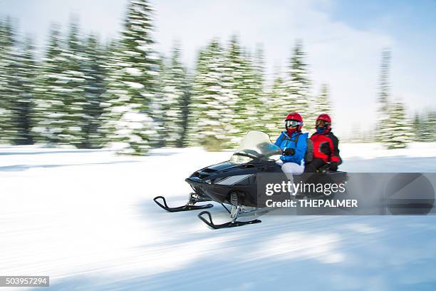 having fun in the winter - snowmobiling stock pictures, royalty-free photos & images