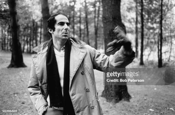 Author, Philip Roth, walking in woods in area where he grew up.