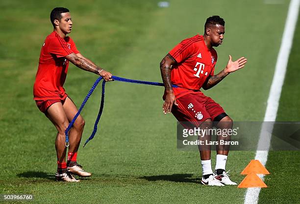 Jerome Boateng trains with Thiago during a training session at day three of the Bayern Muenchen training camp at Aspire Academy on January 8, 2016 in...