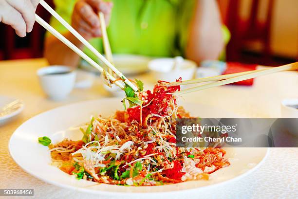 chinese yee sang - prosperity toss stock pictures, royalty-free photos & images