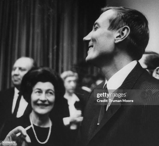 Russian poet Evgeny Evtushenko attending a party.