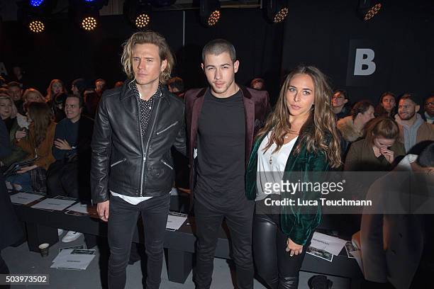 Dougie Poynter, Nick Jonas and Chloe Green attend the TOPMAN Design Front Row during The London Collections Men AW16 at on January 8, 2016 in London,...