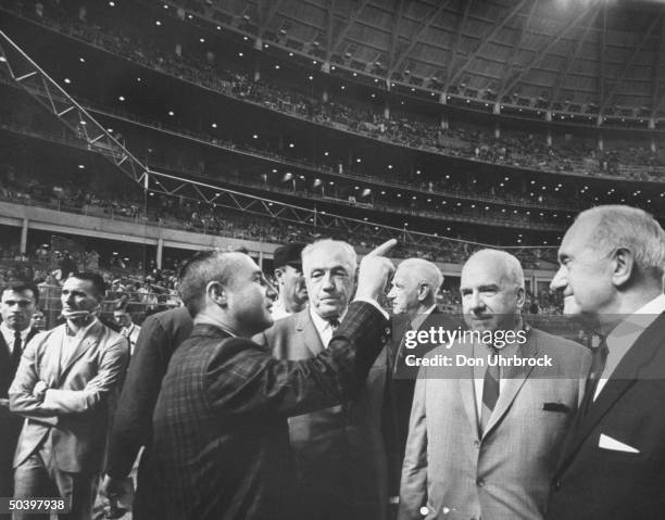 John W. Young with R. Walter Cunningham and Virgil I. Grissom , during opening night, Houston Sports Arena.