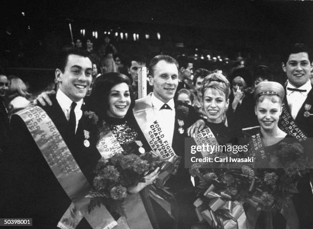 Skaters posing with awards at the World Figure Skating Championships.