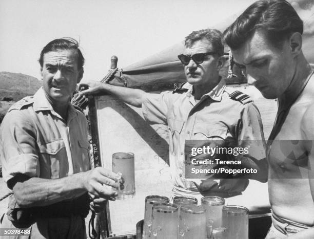 British Army officer Brigadier Louis Hargroves, commander of the British garrison in Aden, stands on left with Air Vice Marshal Johnnie Johnson , air...