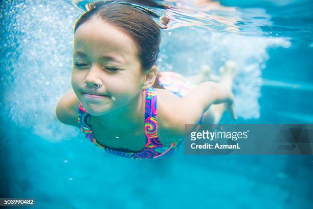 determination - young girls swimming pool stock pictures, royalty-free photos & images