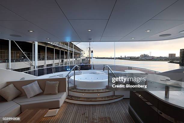 Jacuzzi sits on the upper deck of a 131 yacht, manufactured by Sunseeker International Ltd., on display at the 2016 London Boat Show at the ExCel...
