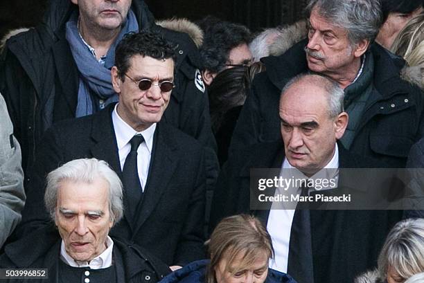 Singer Marc Lavoine and Pascal Negre leave the funeral of French singer Michel Delpech at Saint Sulpice church on January 8, 2016 in Paris, France.