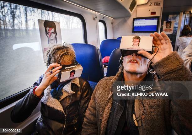 Train passengers take a virtual reality journey through the life of the British pop star David Bowie, which is exhibited in a 'Virtual Bowie Coupe'...