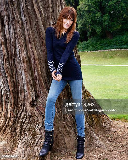 Singer Carla Bruni is photographed for Madame Figaro on June 12, 2015 in Paris, France. Sweater , jeans , necklace , boots . PUBLISHED IMAGE. CREDIT...