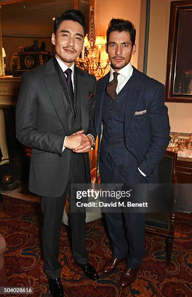 Hu Bing and David Gandy attend a cocktail reception hosted by the Woolmark Company, Pierre Lagrange and the Savile Row Bespoke Association to...