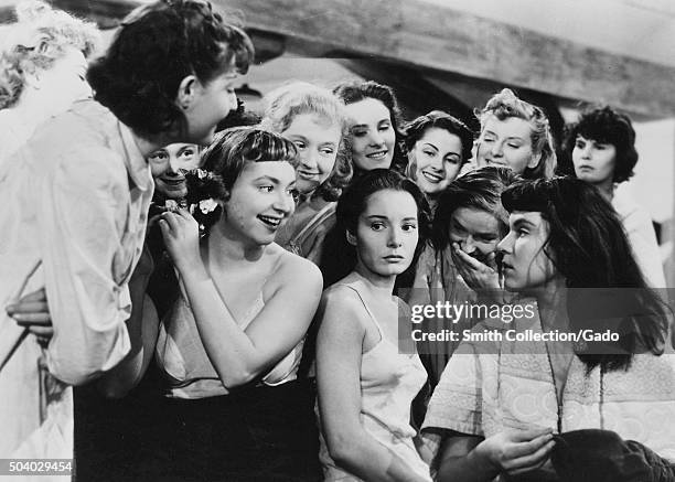 Au Royaume Des Cieux , movie still of girls in a dormatory, several girls appearing to taunt another girl, from the film noir movie by director...