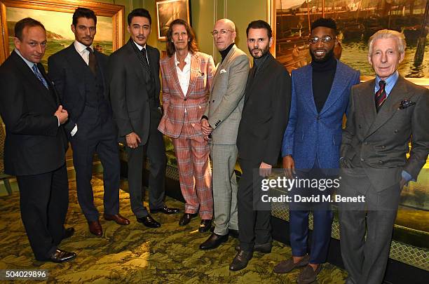 Simon Cundey, David Gandy, Hu Bing, Pierre Lagrange, Dylan Jones, Carlo Brandelli, Tinie Tempah and Edward Sexton attend a cocktail reception hosted...