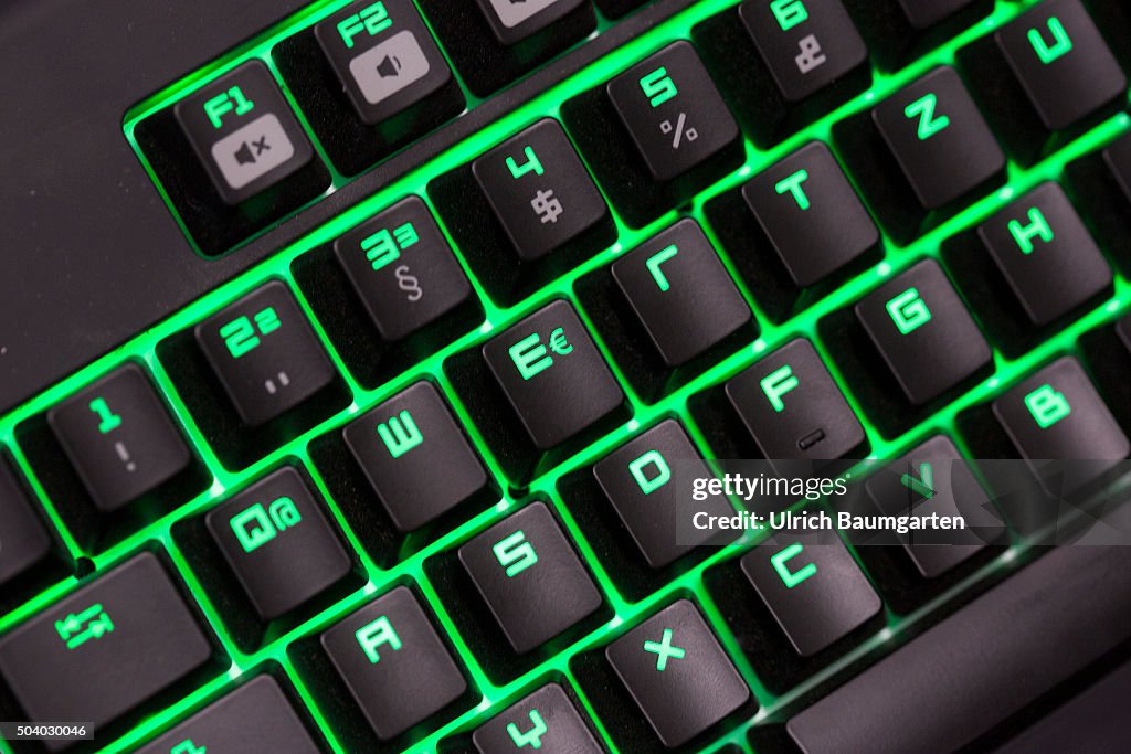 Computer keyboard green illuminated with euro symbol. News Photo - Getty  Images