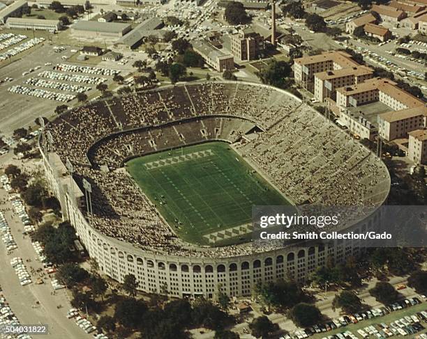 Aerial view of Louisiana State University football stadium with a sparse crowd during a game, Baton Rouge, Louisiana, 1967. .