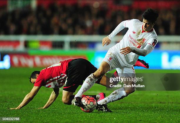 Joao Carlos Teixeira of Liverpool evades Alex Nicholls of Exeter City during the Emirates FA Cup third round match between Exeter City and Liverpool...