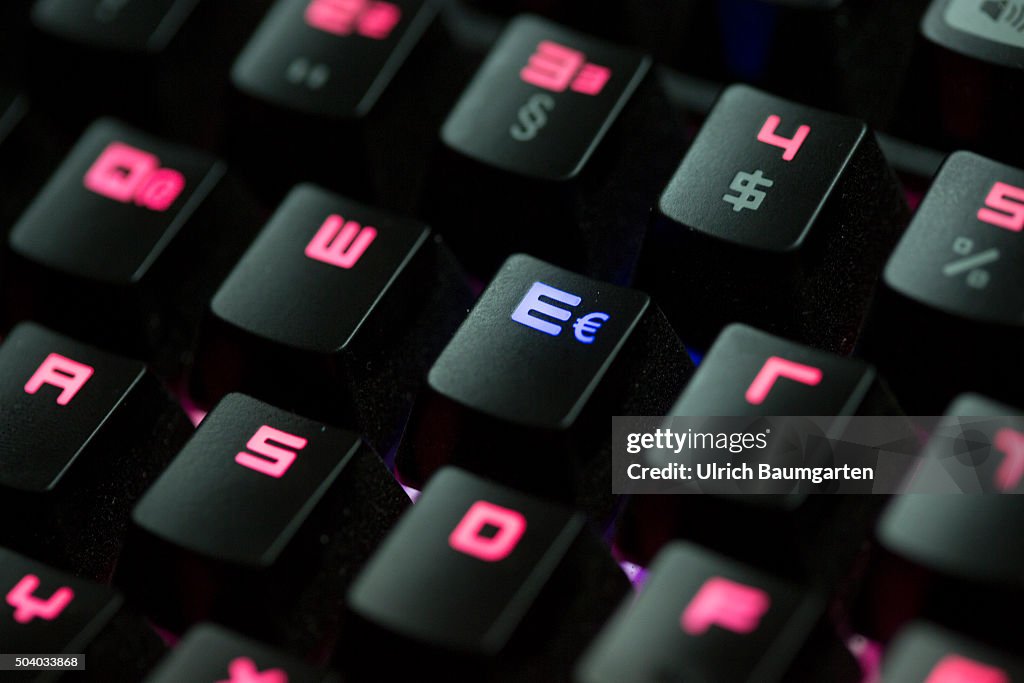 Computer keyboard glows red with a blue illuminated euro symbol. News Photo  - Getty Images