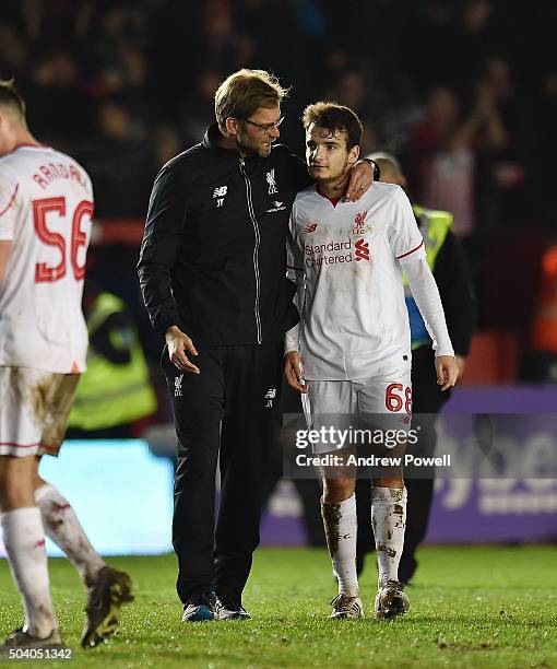 Jurgen Klopp manager of Liverpool talks with Pedro Chirivella of Liverpool during the Emirates FA Cup third round match between Exeter City and...