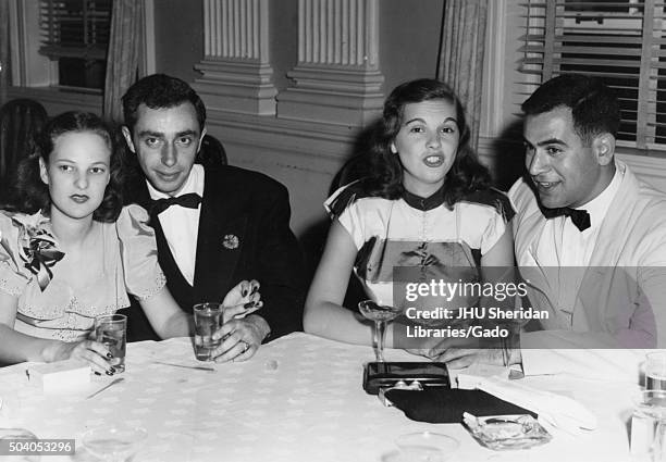 Student Life, Senior Banquet and Dance, Ira Singer, Theodore DeBois, Ira Singer and Ted Debois sitting at a table with their dates during the Senior...