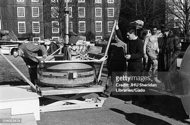Astrophysics, Classes, Student Life Students and faculty are loading a balloon telescope, 1963. .