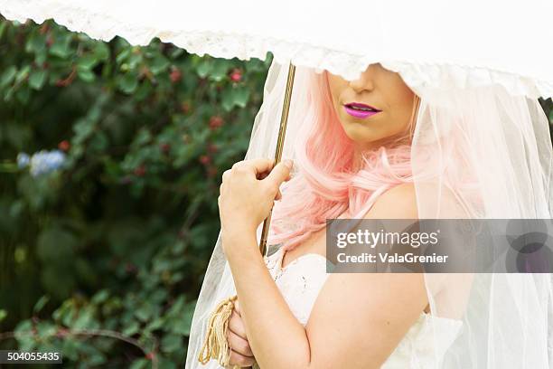 bride with white parasol covering eyes. - lace parasol stock pictures, royalty-free photos & images