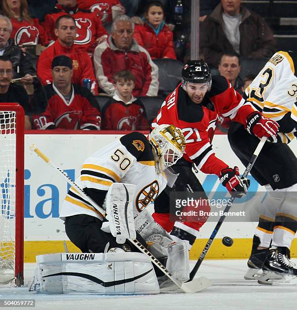 Jonas Gustavsson of the Boston Bruins makes the first period save on Kyle Palmieri of the New Jersey Devils at the Prudential Center on January 8,...