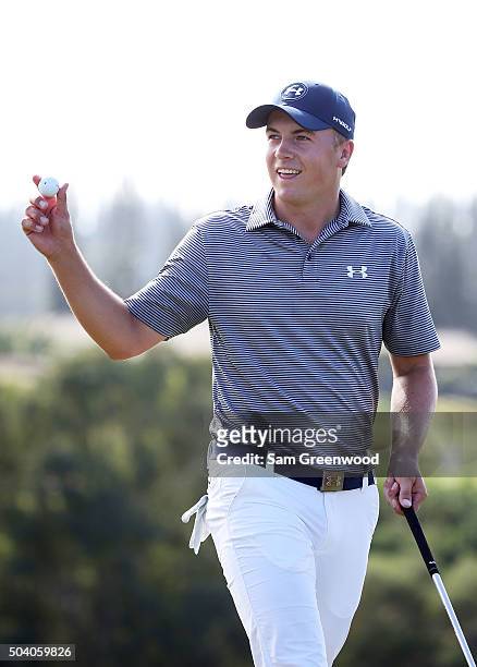Jordan Spieth reacts after chipping for eagle on the ninth hole during round two of the Hyundai Tournament of Champions at the Plantation Course at...