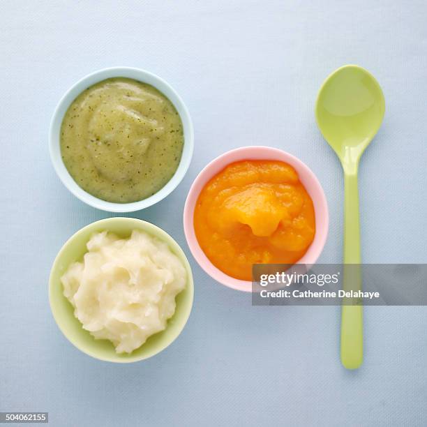 close-up of vegetables mashes in baby bowls - baby food stock pictures, royalty-free photos & images