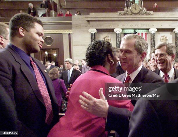 President George W. Bush greeting Rep. Sheila Jackson Lee w. Rep. Jesse Jackson Jr and Senate Majority Leader Trent Lott looking on following Bush's...