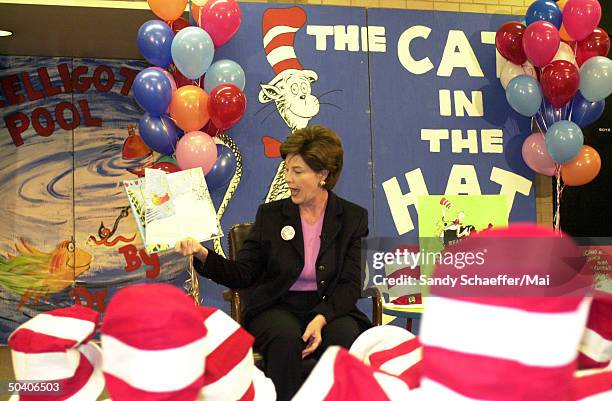 First Lady Laura Bush visiting a local Washington DC elementary school on what would have been the 98th birthday of Dr. Seuss, to promote the Read...