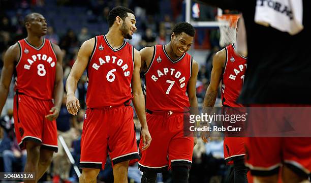 Cory Joseph and Kyle Lowry of the Toronto Raptors walk off the floor during a timeout in the second half of their 97-88 win over the Washington...