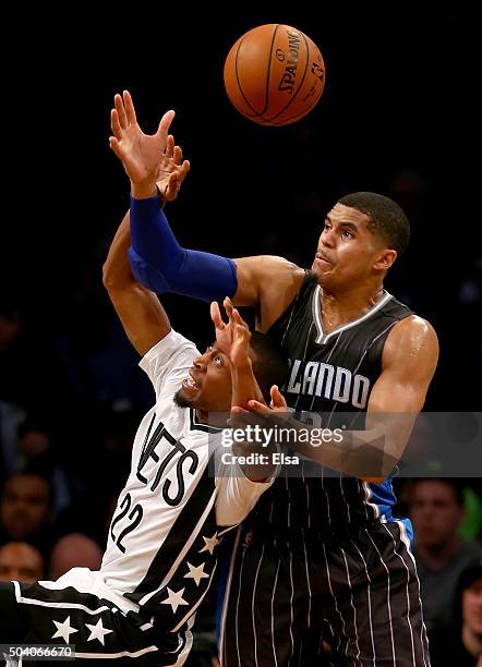 Markel Brown of the Brooklyn Nets loses control of the ball as Tobias Harris of the Orlando Magic defends on January 8,2016 at the Barclays Center in...