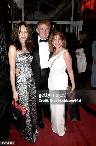 Real estate mogul Donald Trump w. Girlfriend Melania Knauss and Ambassabor of Equador Ivonne A-Baki arriving at party following Annual Dinner of the...