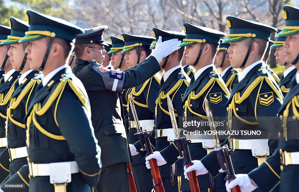 Jsdf Mp A senior official of the Japanese Ground Self Defence Force checks ...